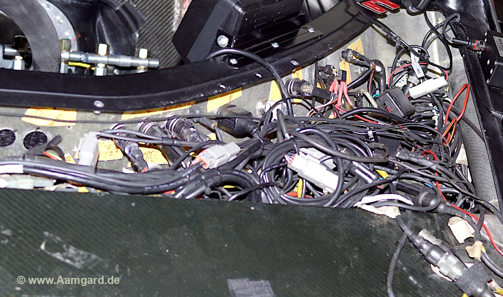 spaghetti cabling inside a classic Le Mans racing sports car